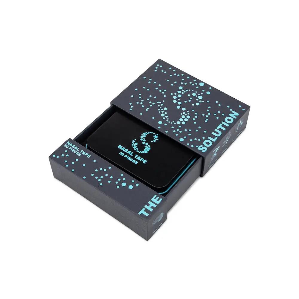 Black nasal tape for better breathing in a stylish packaging box, featuring the words 'The Solution'.