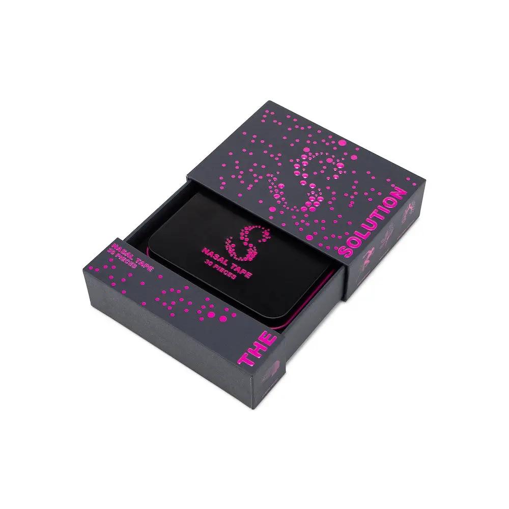 Pink nasal tape for better breathing in a stylish packaging box, featuring the words 'The Solution'.