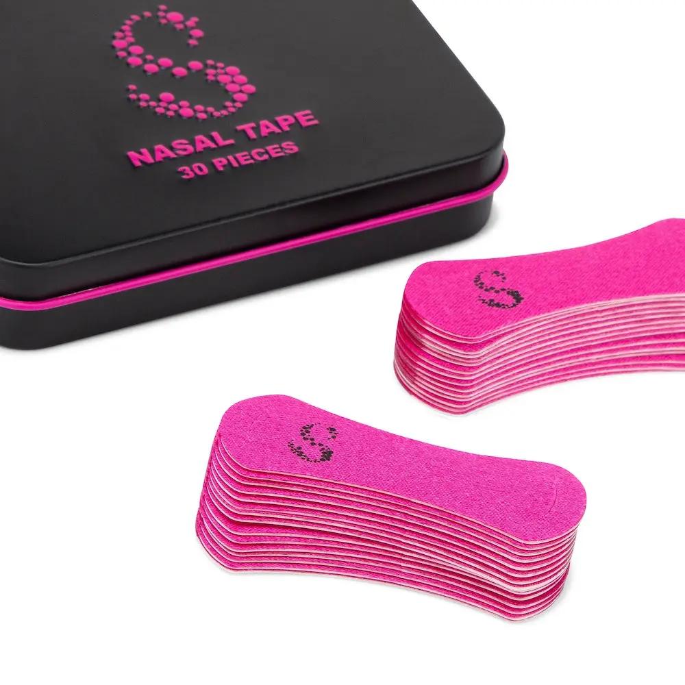 Pink nasal tape for better breathing in a box of 30 pieces, designed for enhanced nasal breathing while sleeping.